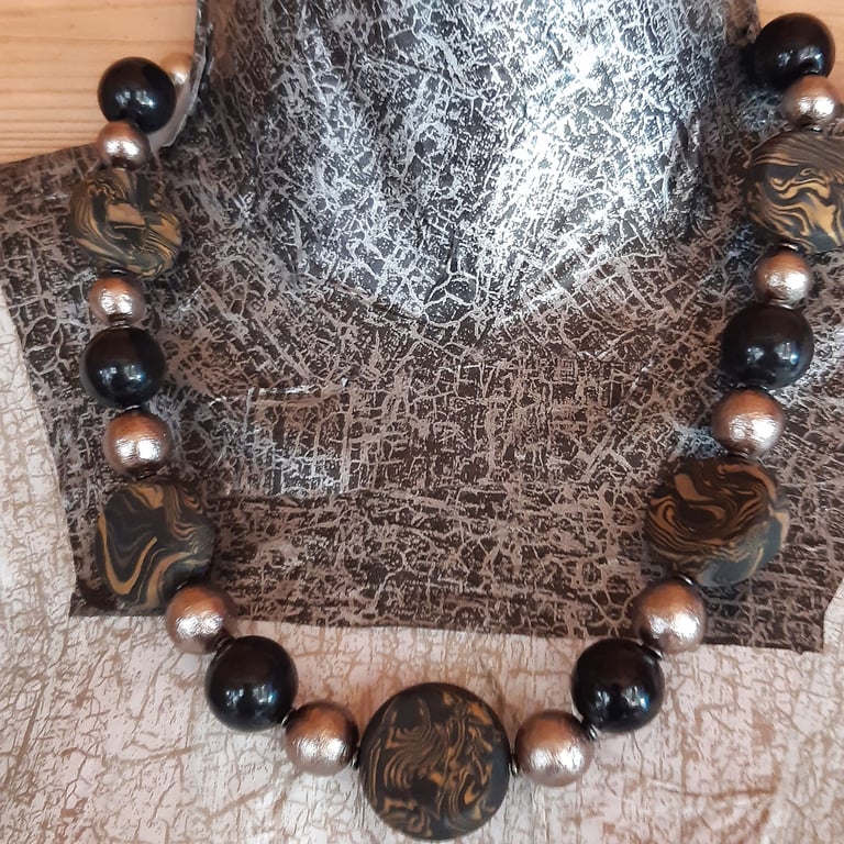 Gold and black disc shaped necklace