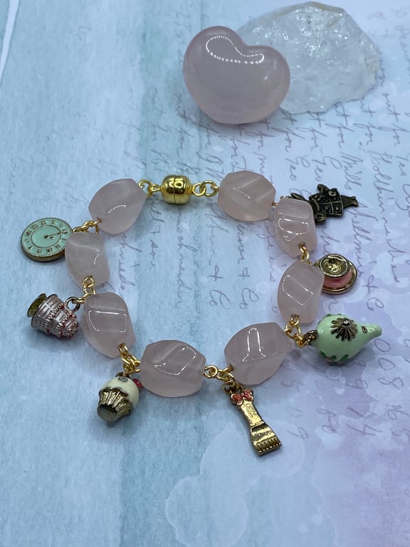 Rose quartz bracelet with Alice in Wonderland themed charms