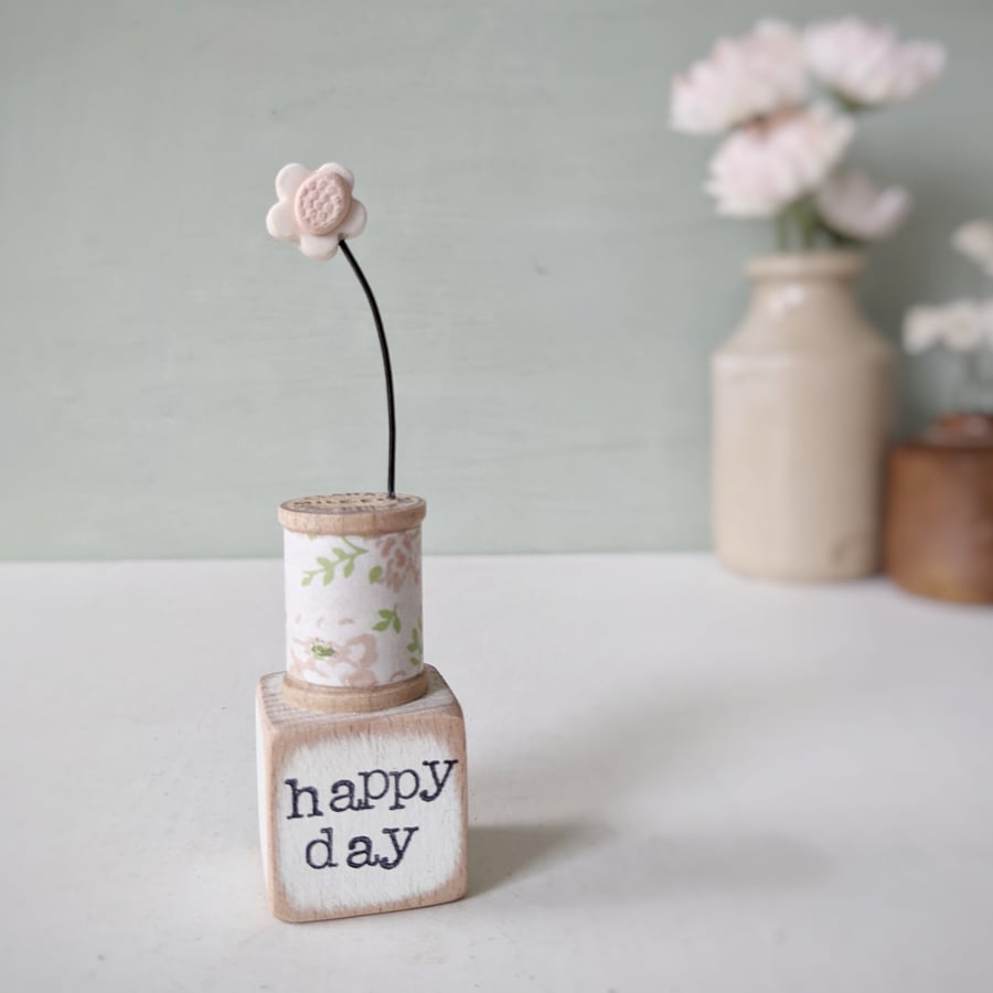 Clay Flower on a Teeny Bobbin 'happy day