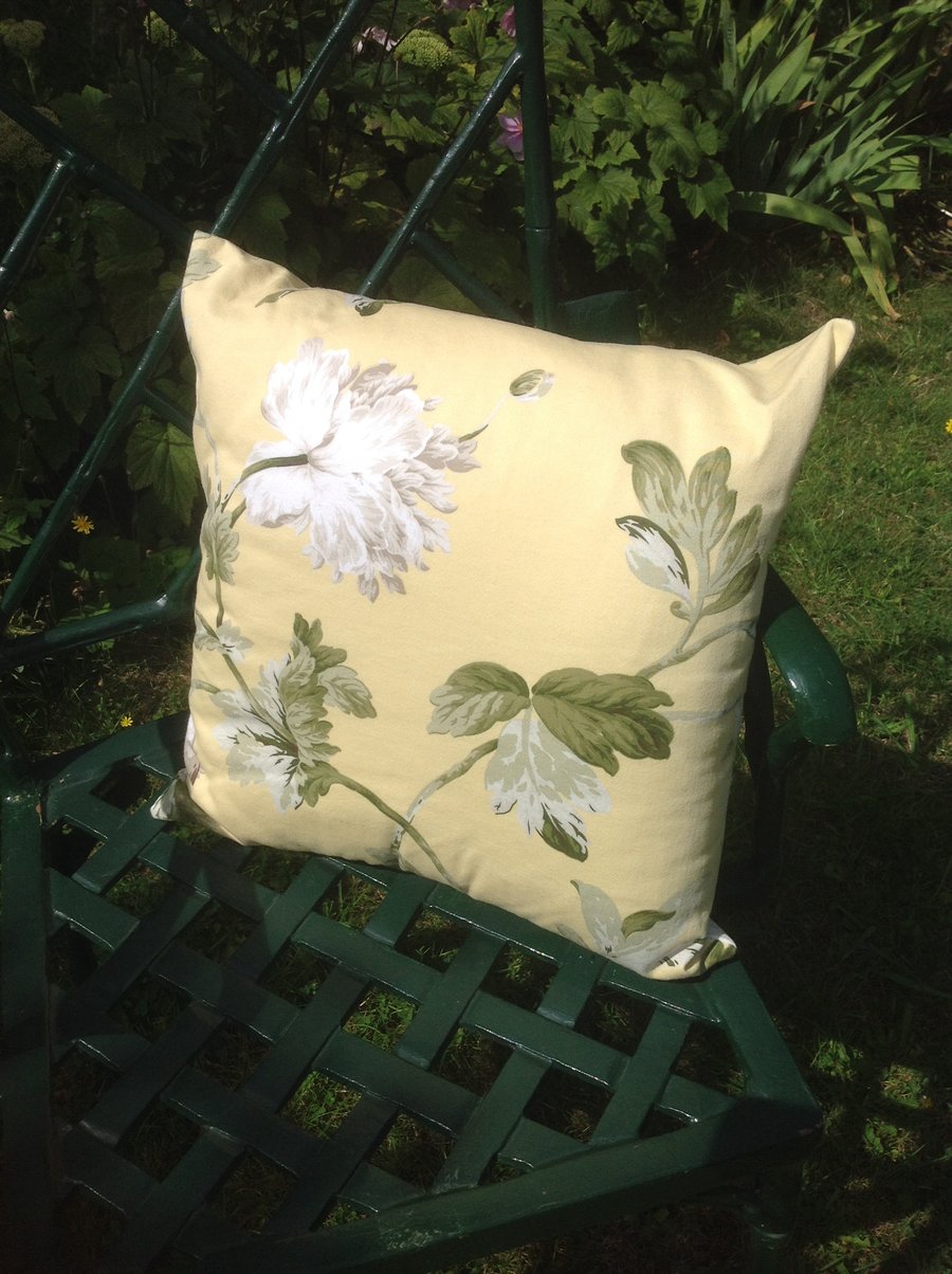 Yellow and white floral cushion