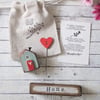 Little Wooden Painted House and Base in a Bag