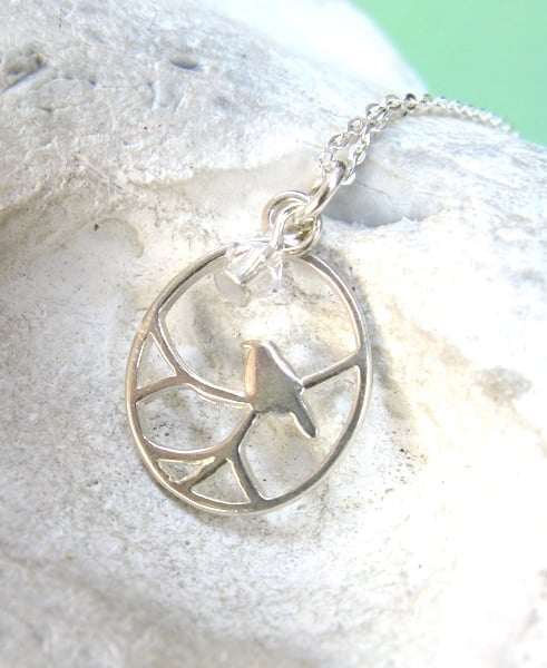 Tiny bird on branch necklace in sterling silver