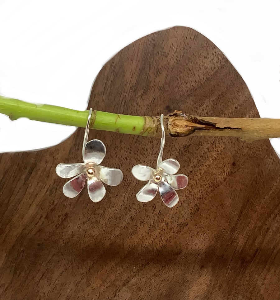 Sterling silver flower with 9 carat gold centre dangly earrings