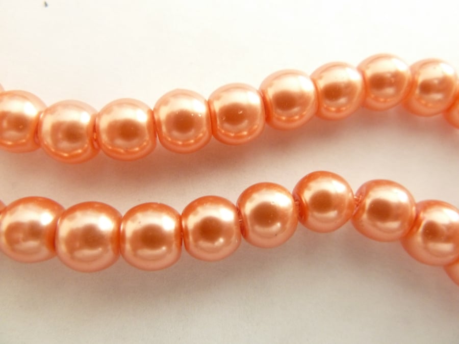 100 peach glass pearls