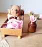 Primitive Tiny Ted in a matchbox bed