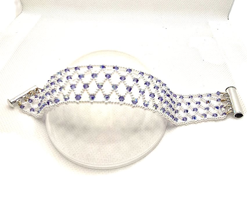 A seed bead netted bracelet with purple Swarovski crystals