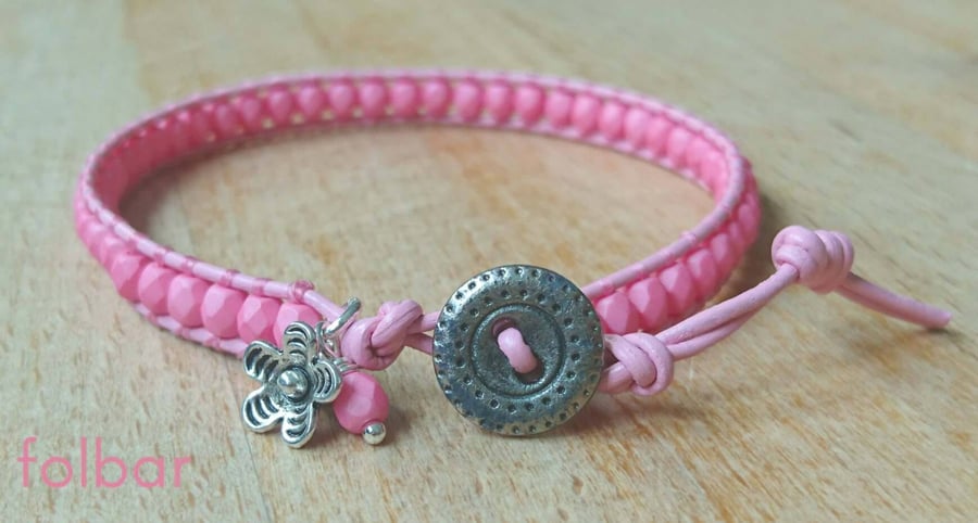 Pale pink leather and glass bead bracelet with button fastener