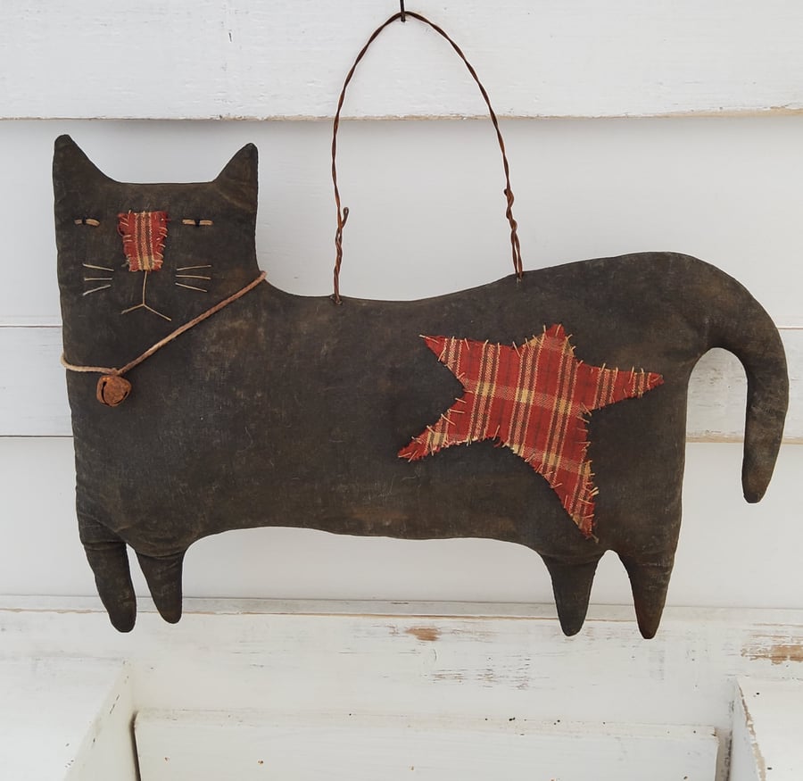 Primitive hanging black cat