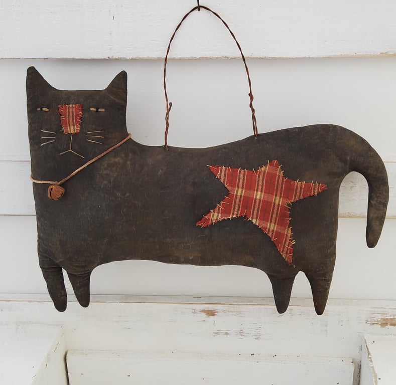 Primitive hanging black cat