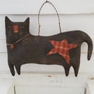Primitive hanging black cat