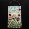 Ceramic "How does your garden grow?" wall plaque