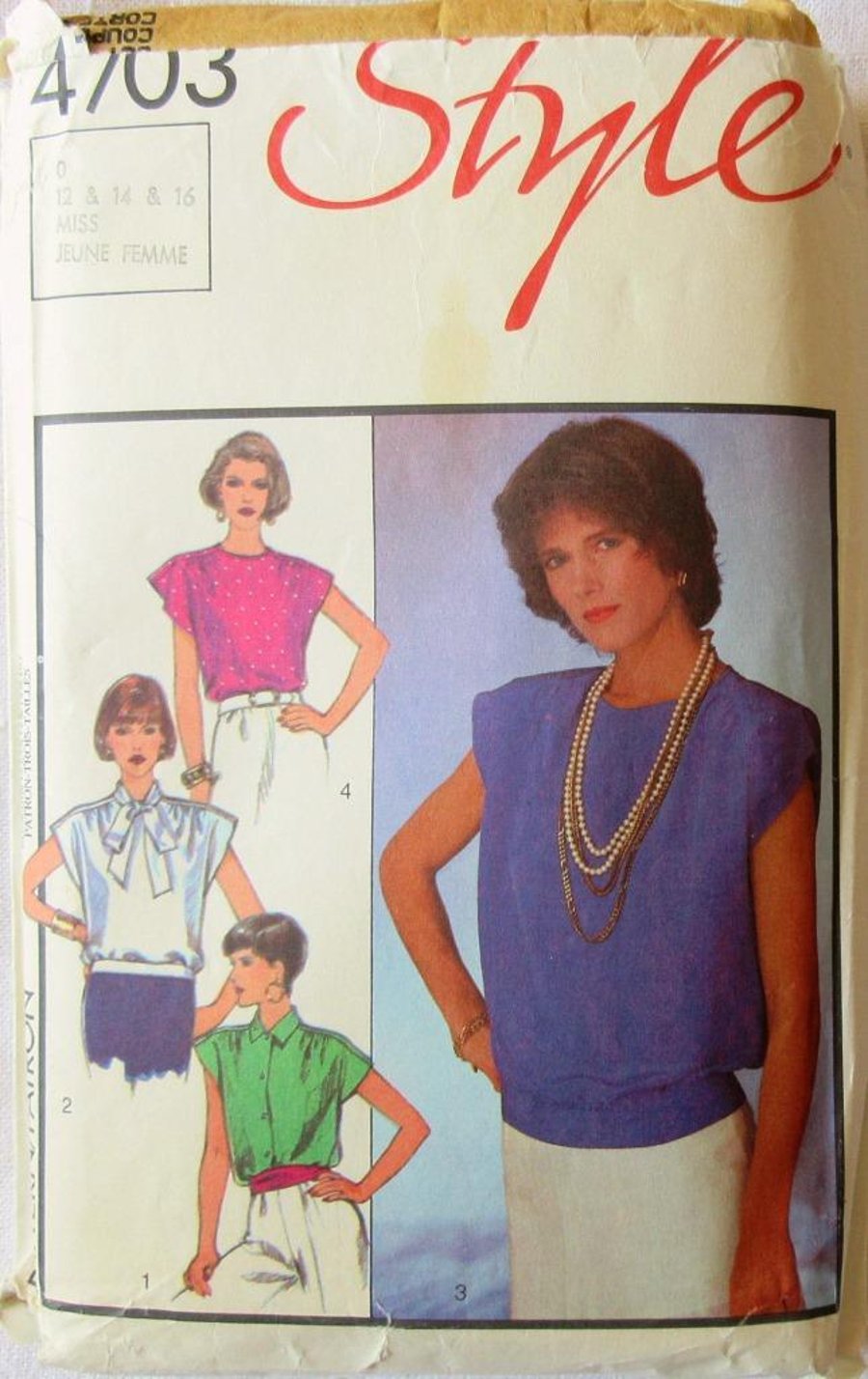 A multi-size sewing pattern for a misses' blouse in 4 styles (Style 4703)