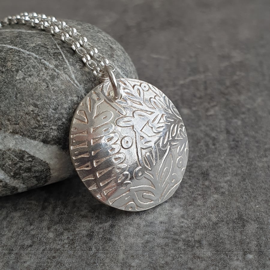 Silver disc pendant with leaf print pattern, Botanical jewellery
