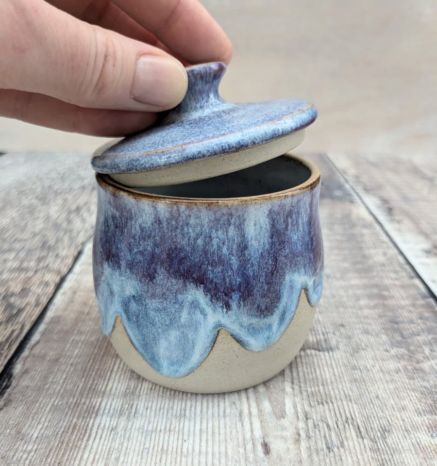 Small ceramic lidded pot with a purple and blue glaze