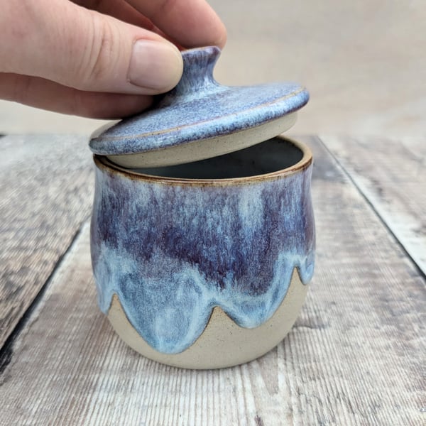 Small ceramic lidded pot with a purple and blue glaze
