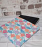 BOOKSLEEVE IN MULTI COLOURED FISH DESIGN