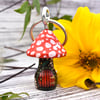 Little red mushroom house keyring hand burned using pyrography.