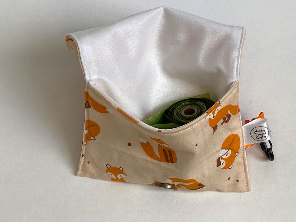 Dog treat bag with small carabiner clip. Orange foxes