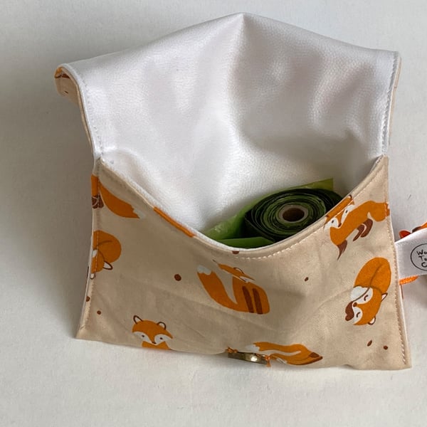 Dog treat bag with small carabiner clip. Orange foxes