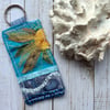 Up cycled embroidered sun keyring or bag charm.