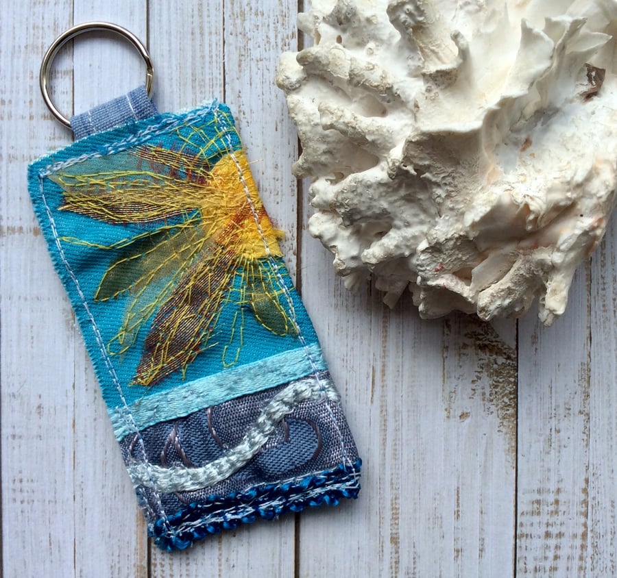 Up cycled embroidered sun keyring or bag charm.