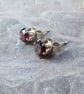 Sterling silver stud earrings with faceted garnet; January birthstone