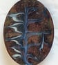 brooch - oval scrolled white and blue-grey on black over clear enamel - Image 1