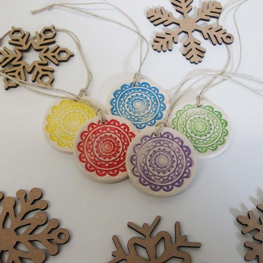Set of five little brightly patterned handmade ceramic decorations