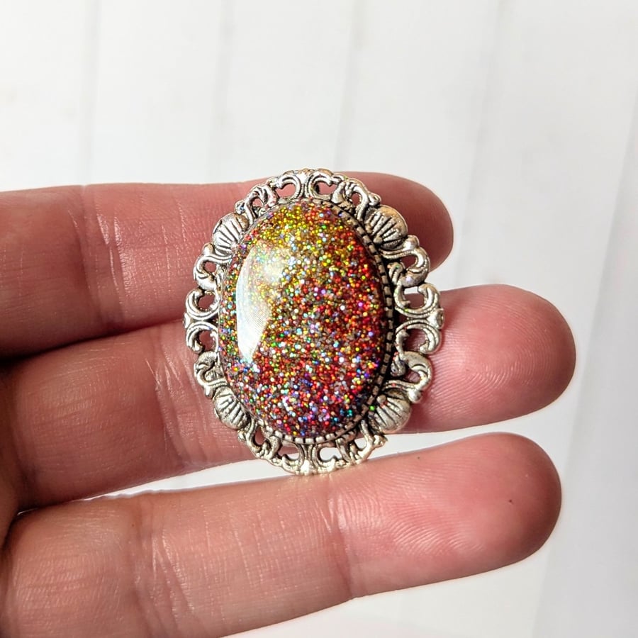 Oval scroll border alloy firestone brooch 