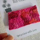 red brooch