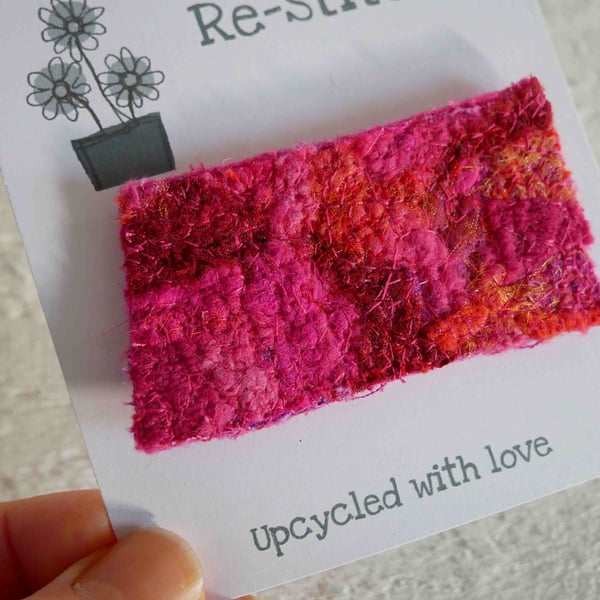 red brooch