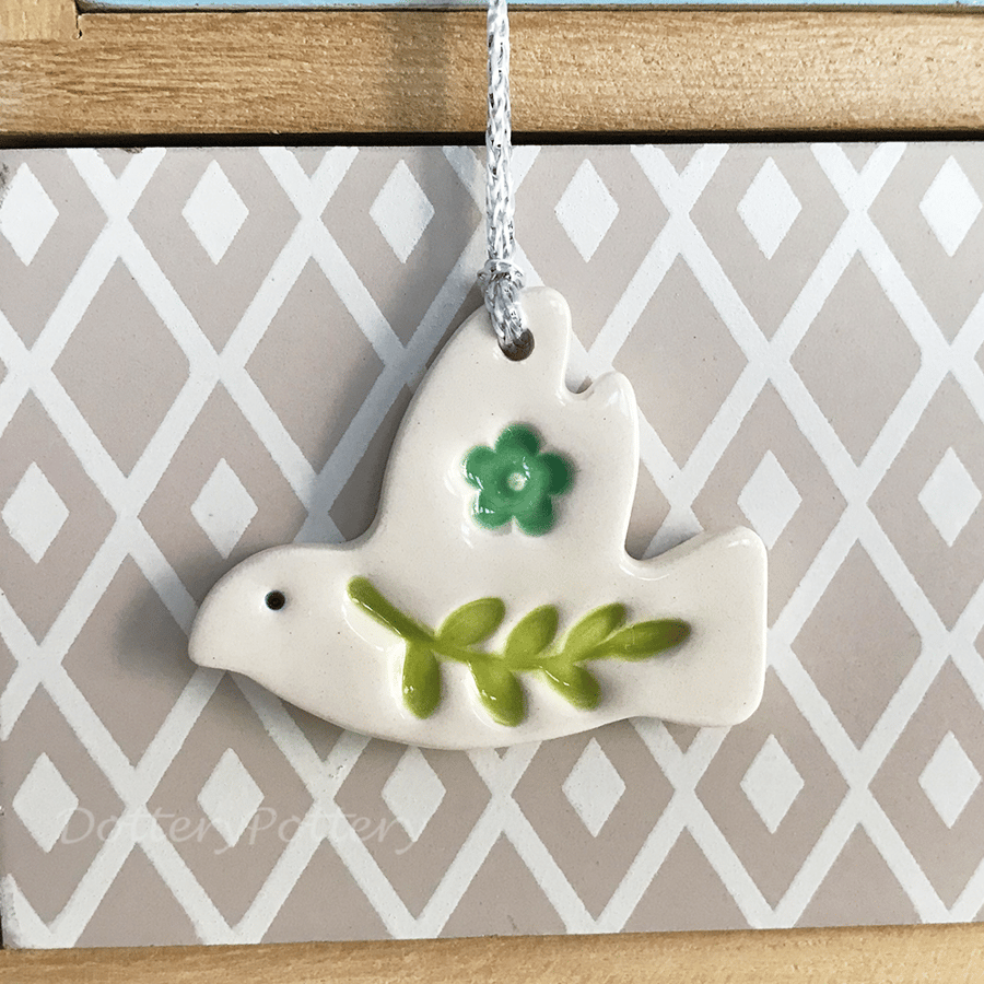 Teeny ceramic dove decoration with leaves and turquoise flower