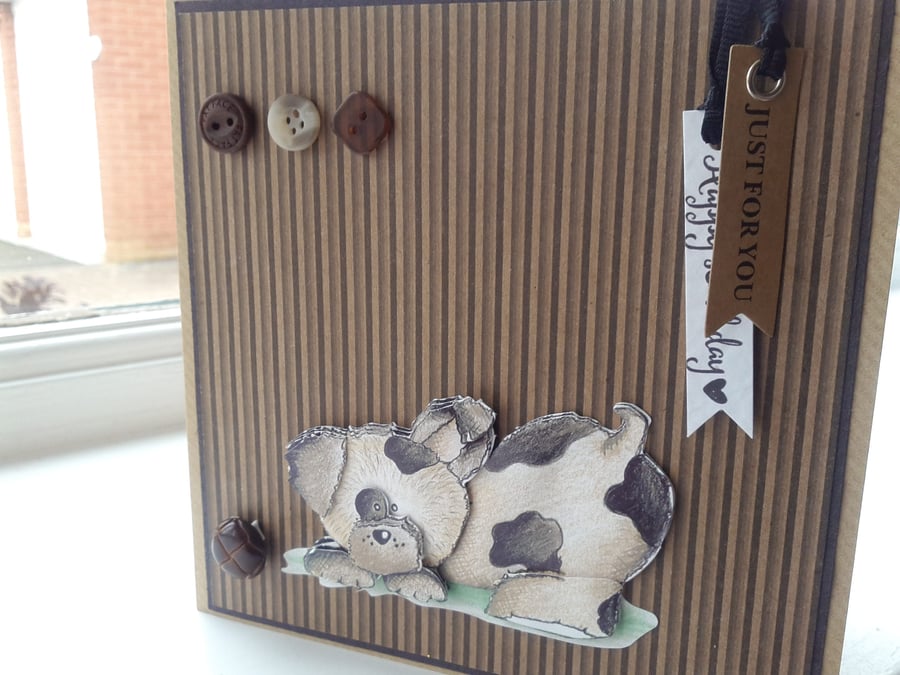 Cute doggie playing ball birthday card