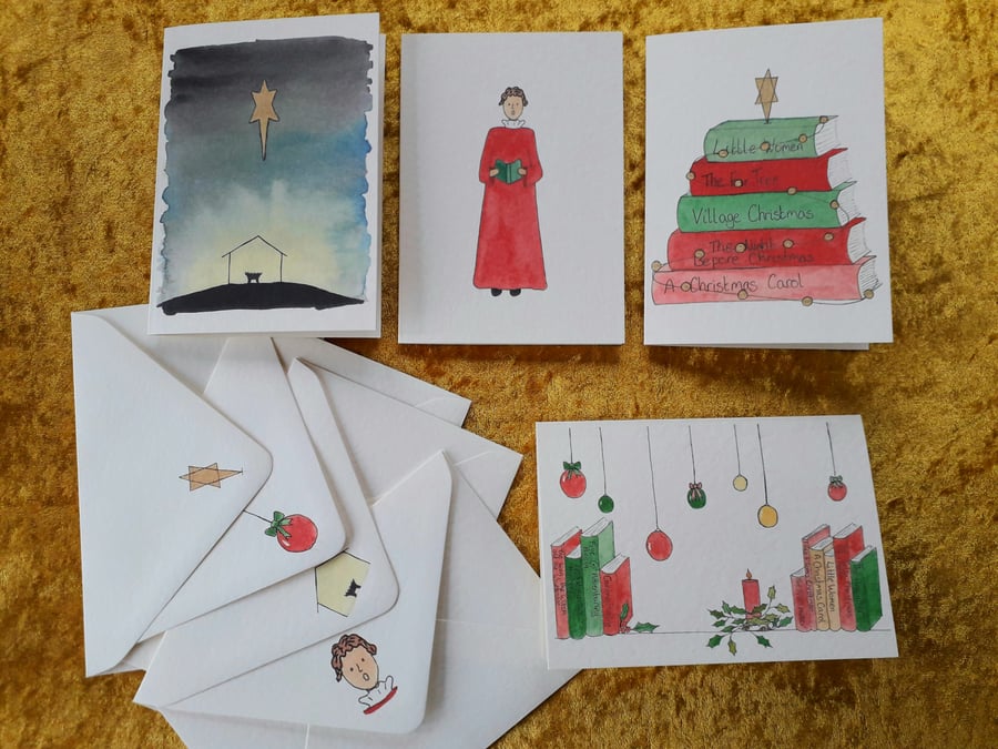 Pack of four Christmas cards with a mix of original designs
