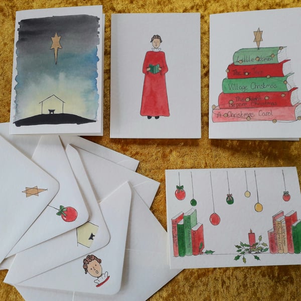 Pack of four Christmas cards with a mix of original designs