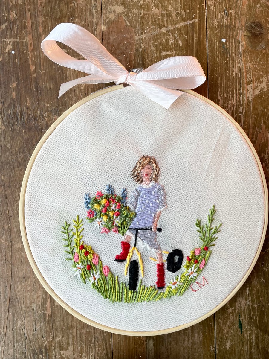 Handmade embroidered art of girl and flowers 