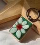 Glass daisy keyring 