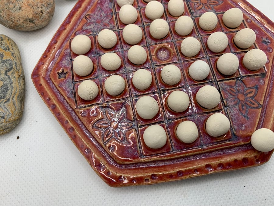 Small ceramic solitaire game