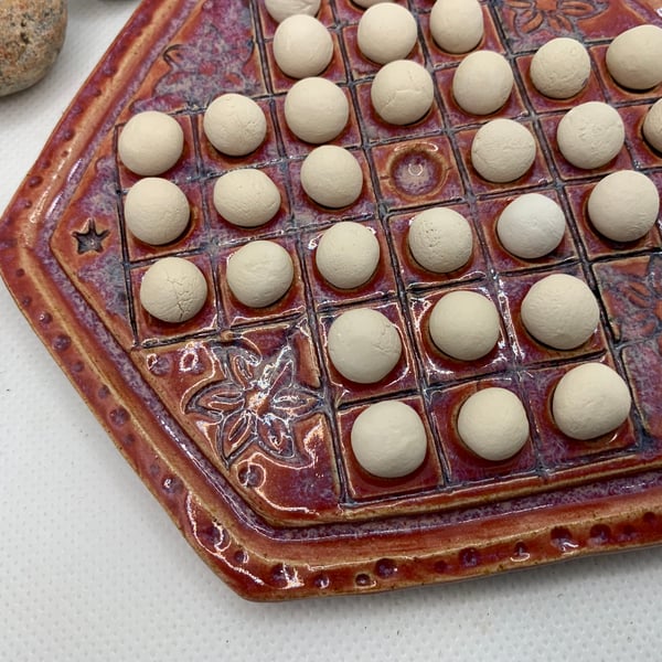 Small ceramic solitaire game