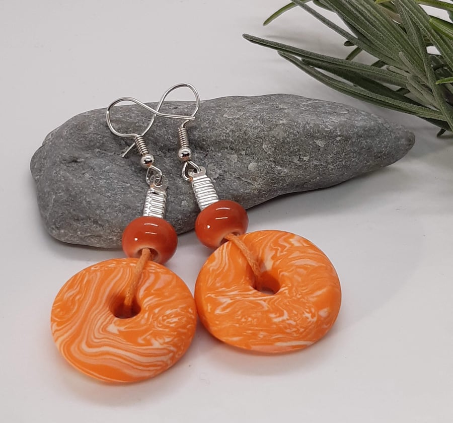 Bright orange statement earrings