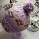 Hand knitted baby hat with rib and Pom Pom.