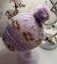 Hand knitted baby hat with rib and Pom Pom.