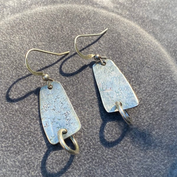 Spin and dangle artefact earrings