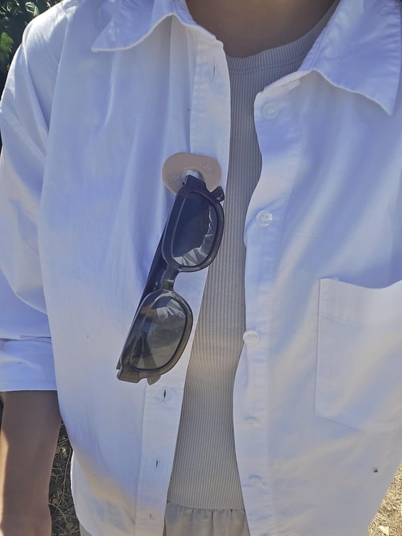 Summer inspired glasses holding brooch pin.