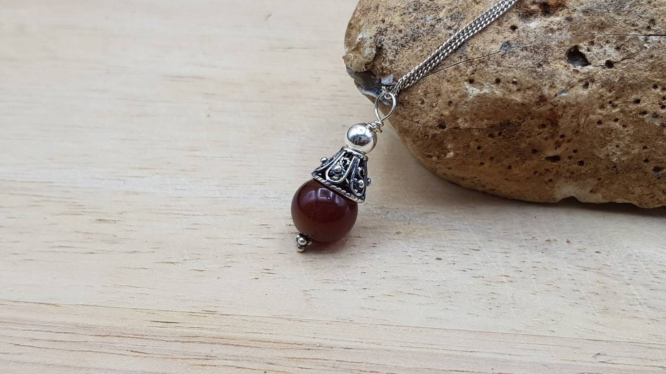 Minimalist Sardonyx cone pendant. August birthstone