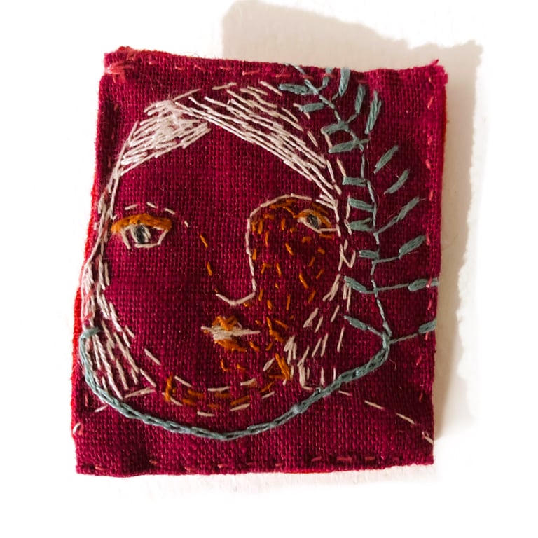 Face brooch 1