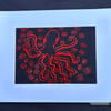 Hand embroidered octopus picture.