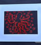 Hand embroidered octopus picture.