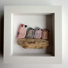 Framed family of 4 ceramic birds perched on driftwood