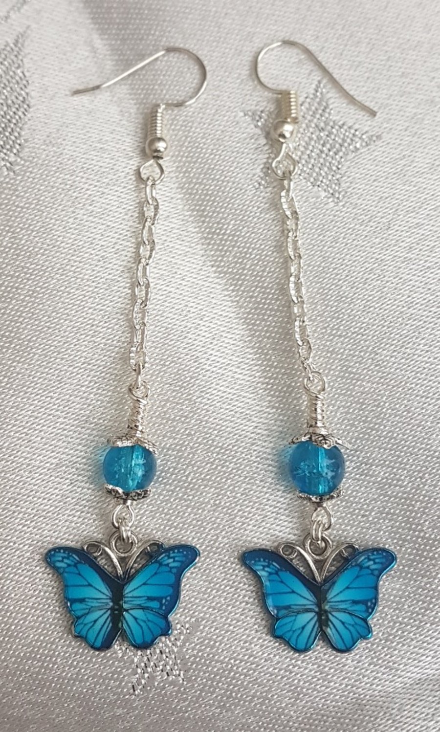 Gorgeous Dangly Blue Butterfly Earrings - Silver Tones.